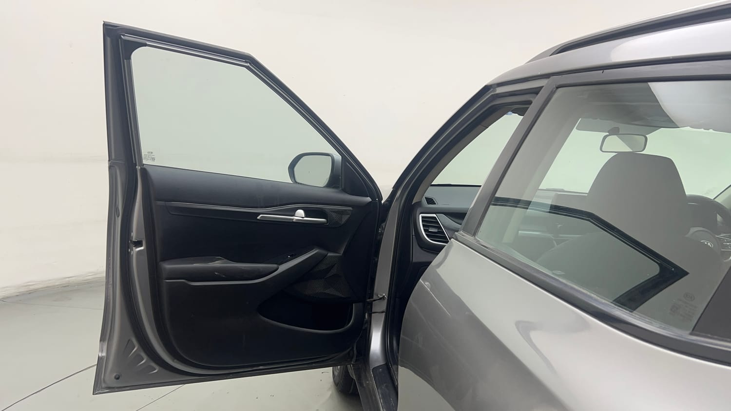 Used 2020 Kia Seltos HTK Plus 1.5 Petrol Manual interior LEFT FRONT DOOR OPEN VIEW