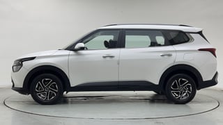 Used 2022 Kia Carens Prestige Plus 1.4 Petrol MT 7 STR Petrol Manual exterior LEFT SIDE VIEW