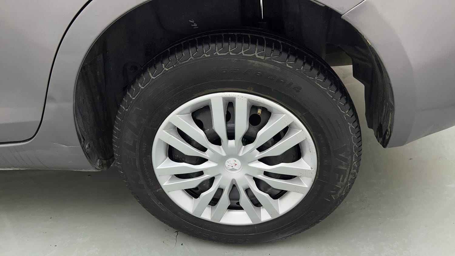 Used 2014 Maruti Suzuki Swift Dzire VXI Petrol Manual tyres LEFT REAR TYRE RIM VIEW