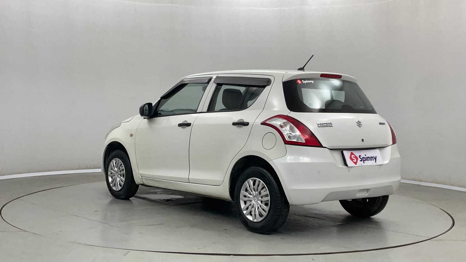 Used 2016 Maruti Suzuki Swift Lxi (O) Petrol Manual exterior LEFT REAR CORNER VIEW