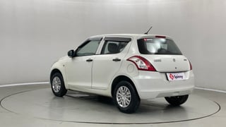 Used 2016 Maruti Suzuki Swift Lxi (O) Petrol Manual exterior LEFT REAR CORNER VIEW