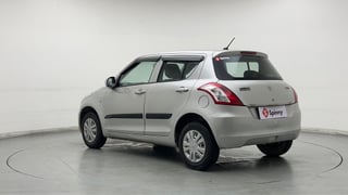 Used 2017 Maruti Suzuki Swift Lxi (O) Petrol Manual exterior LEFT REAR CORNER VIEW