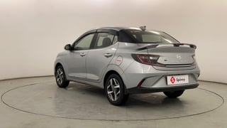 Used 2023 Hyundai Aura SX 1.2 (O) Petrol Petrol Manual exterior LEFT REAR CORNER VIEW