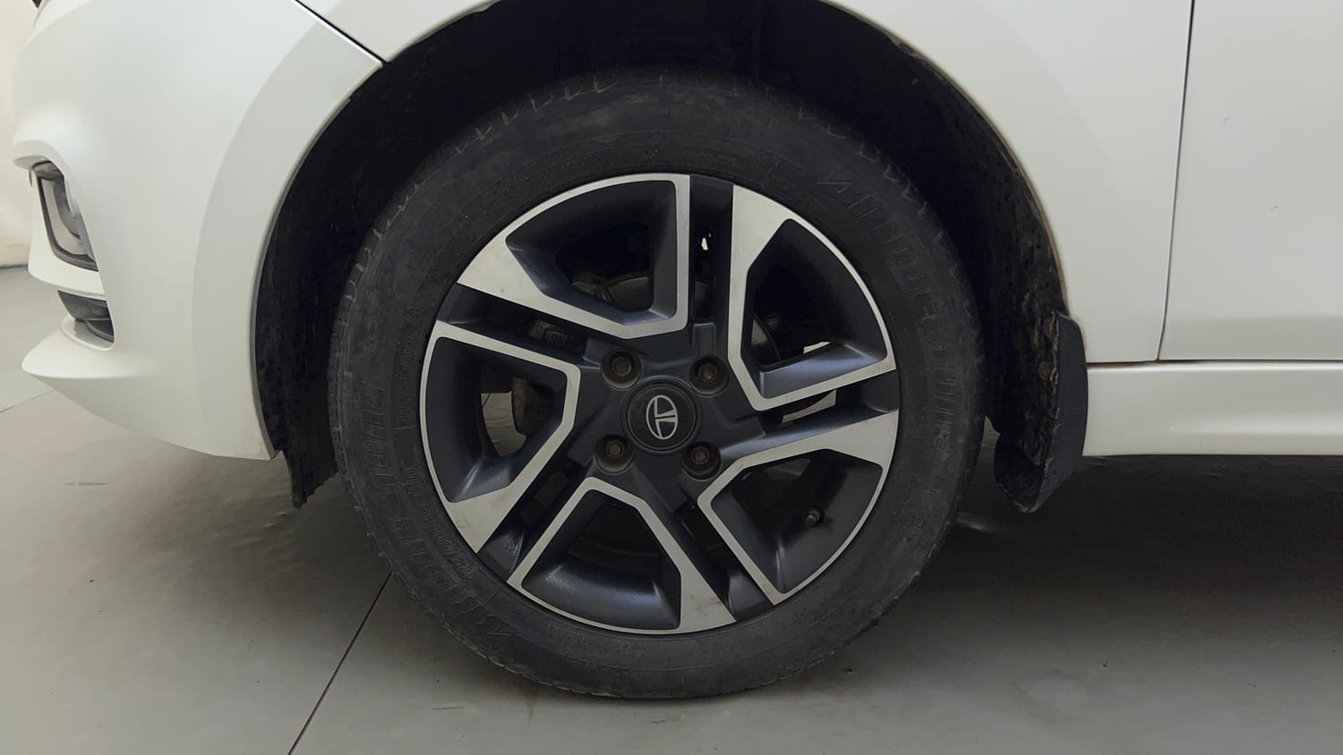 Used 2021 Tata Tigor XZ Plus Petrol Manual tyres LEFT FRONT TYRE RIM VIEW