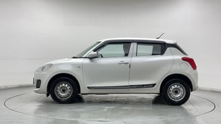 Used 2024 Maruti Suzuki Swift LXi Petrol Manual exterior LEFT SIDE VIEW