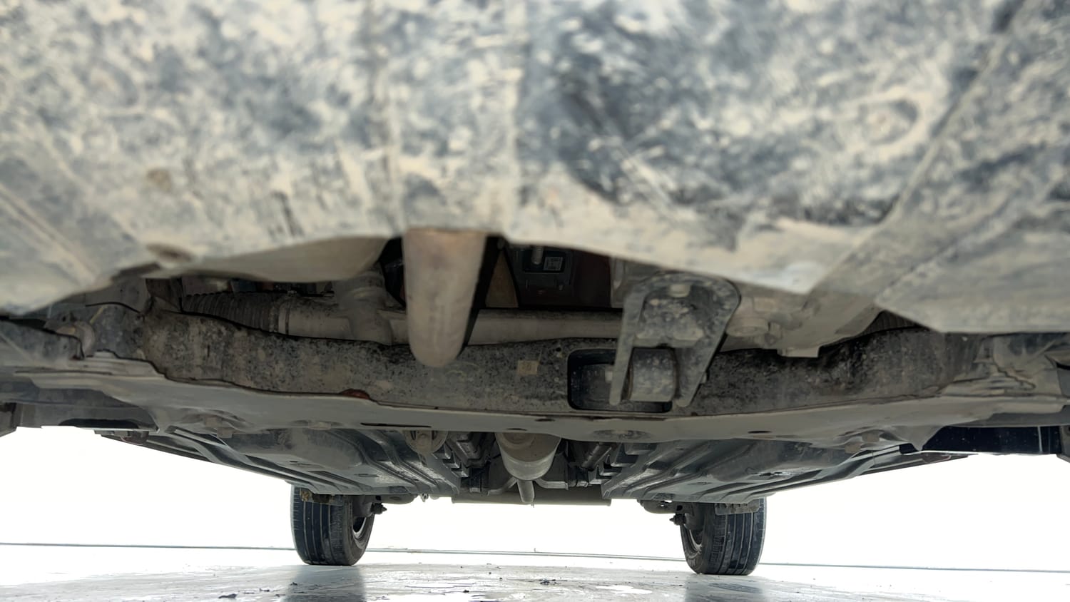 Used 2025 Maruti Suzuki Brezza Zxi Plus AT Dual Tone Petrol Automatic extra FRONT LEFT UNDERBODY VIEW