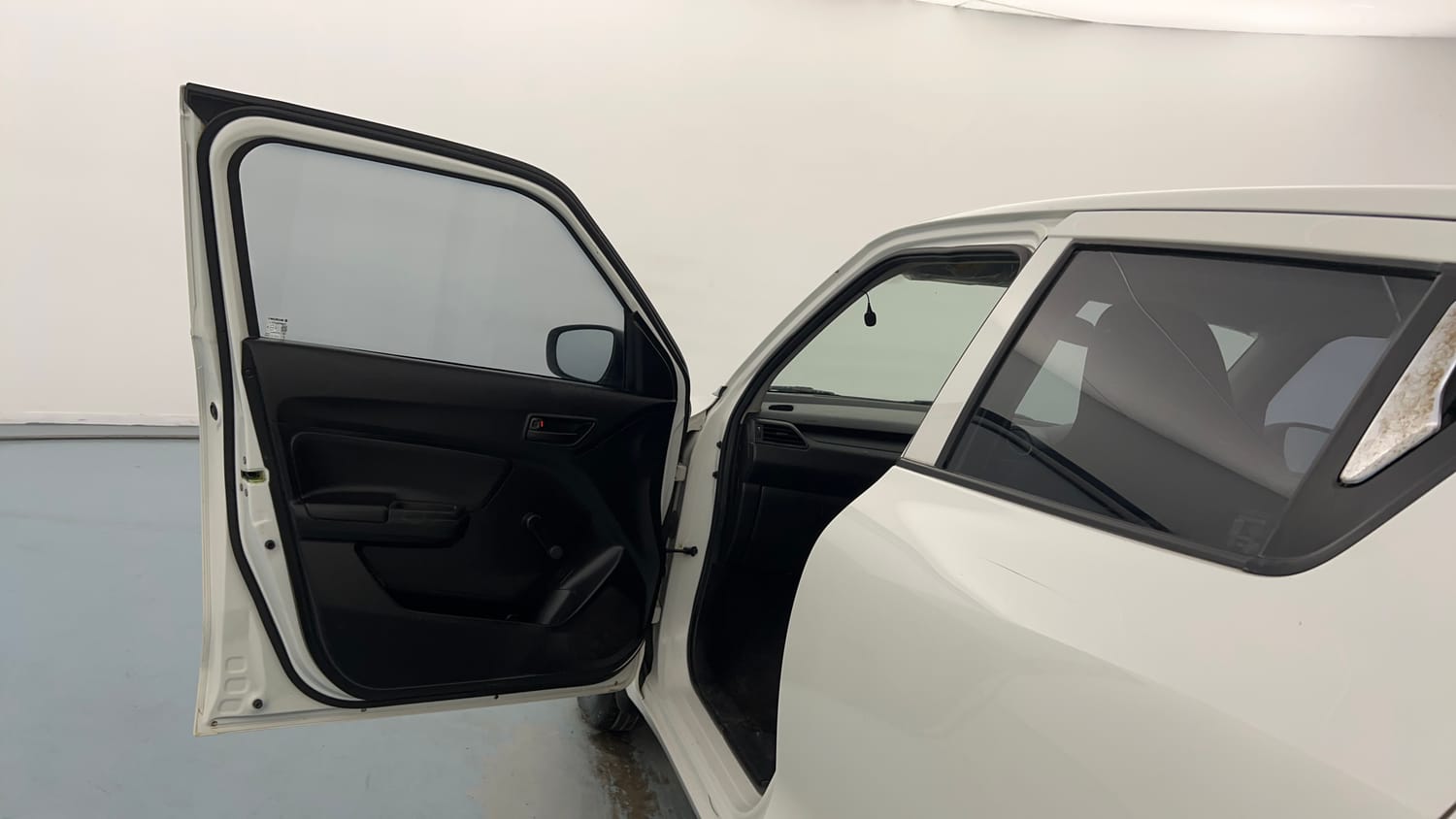 Used 2020 Maruti Suzuki Swift LXi Petrol Manual interior LEFT FRONT DOOR OPEN VIEW