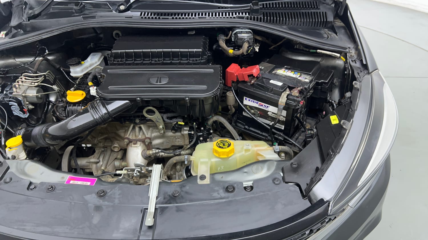 Used 2023 Tata Tigor XZ Plus Leatherette Pack Petrol Manual engine ENGINE LEFT SIDE VIEW