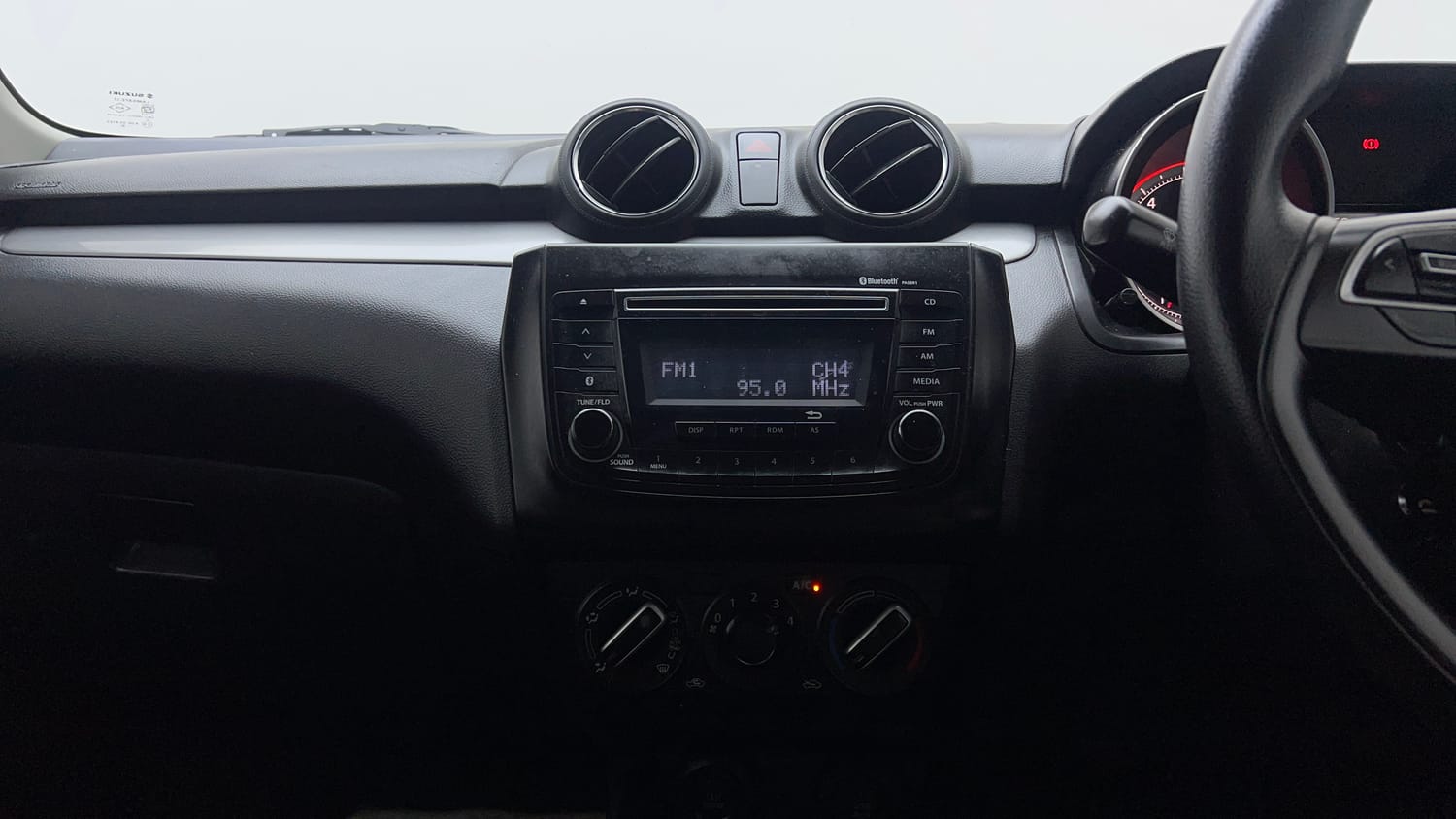 Used 2018 Maruti Suzuki Swift VXi Petrol Manual top_features Integrated (in-dash) music system