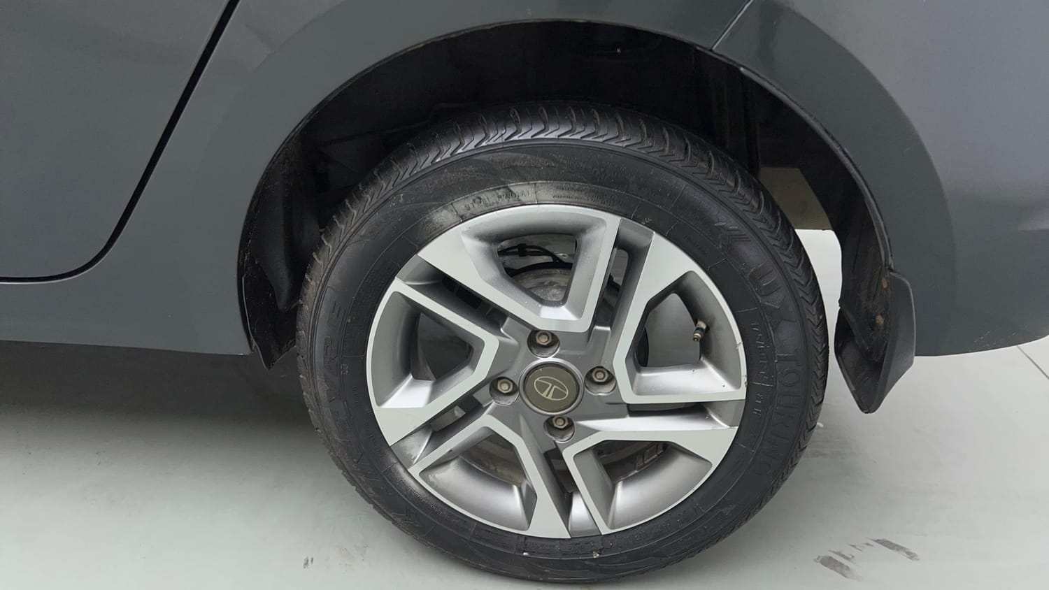 Used 2023 Tata Tigor XZ Plus Leatherette Pack Petrol Manual tyres LEFT REAR TYRE RIM VIEW