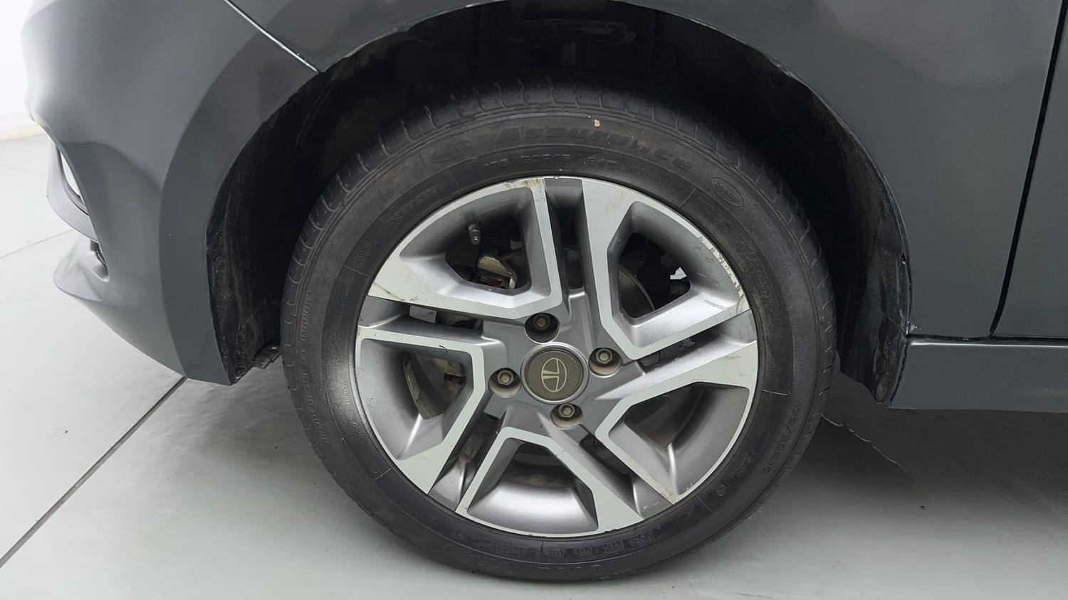 Used 2023 Tata Tigor XZ Plus Leatherette Pack Petrol Manual tyres LEFT FRONT TYRE RIM VIEW