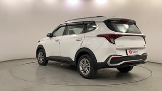 Used 2022 Kia Carens Prestige 1.4 Petrol MT 7 STR Petrol Manual exterior LEFT REAR CORNER VIEW
