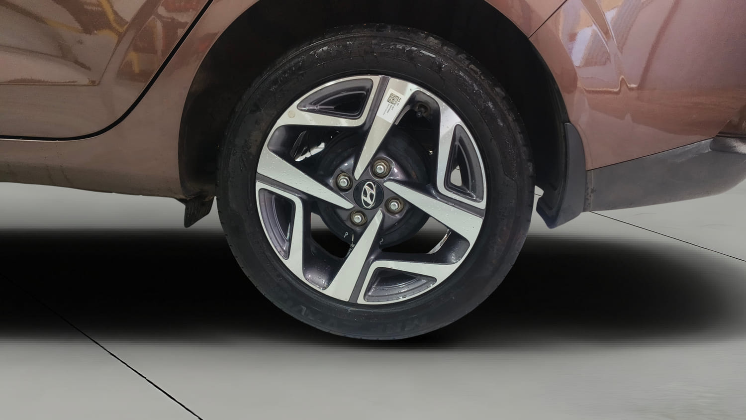 Used 2022 Hyundai Aura SX 1.2 Petrol Petrol Manual tyres LEFT REAR TYRE RIM VIEW
