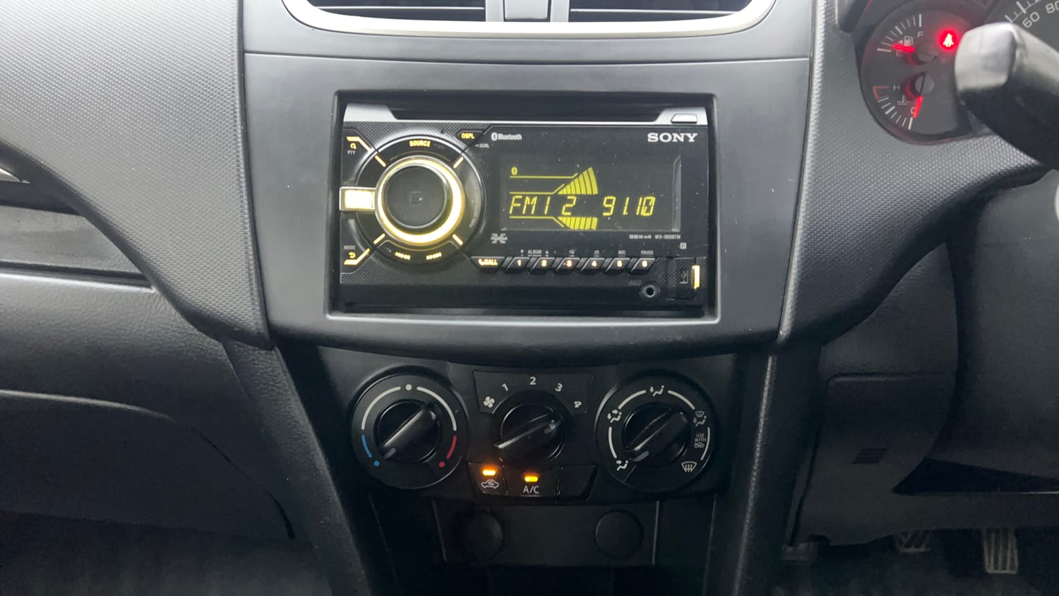 Used 2017 Maruti Suzuki Swift Lxi (O) Petrol Manual interior MUSIC SYSTEM & AC CONTROL VIEW