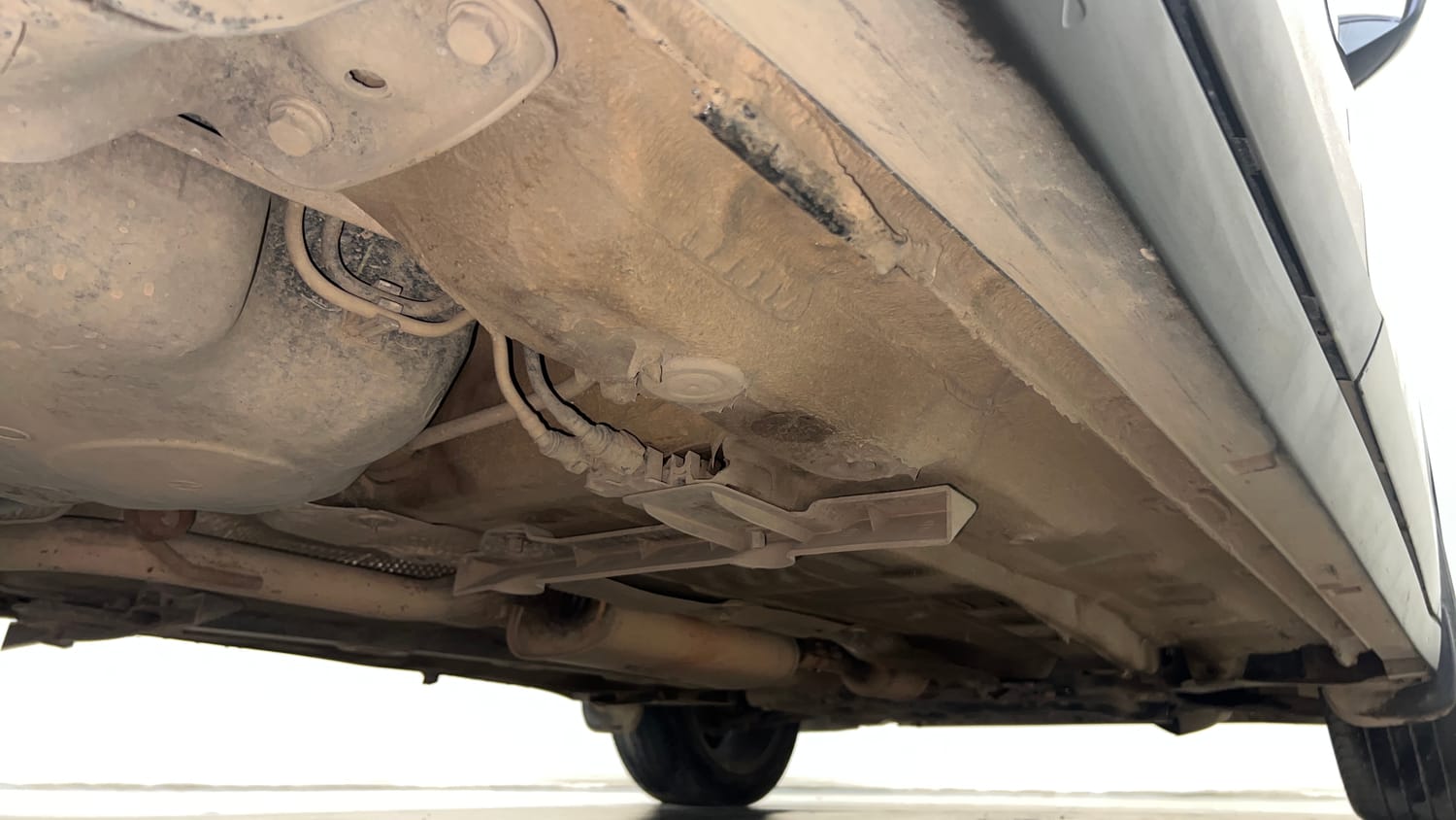 Used 2023 Volkswagen Taigun Topline 1.0 TSI MT Petrol Manual extra REAR RIGHT UNDERBODY VIEW
