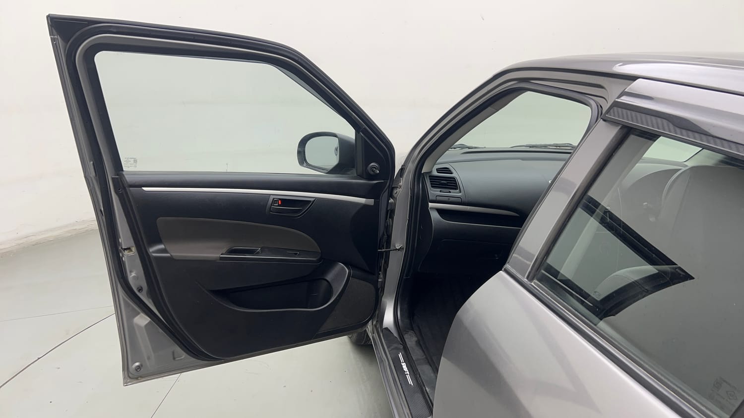 Used 2017 Maruti Suzuki Swift Lxi (O) Petrol Manual interior LEFT FRONT DOOR OPEN VIEW