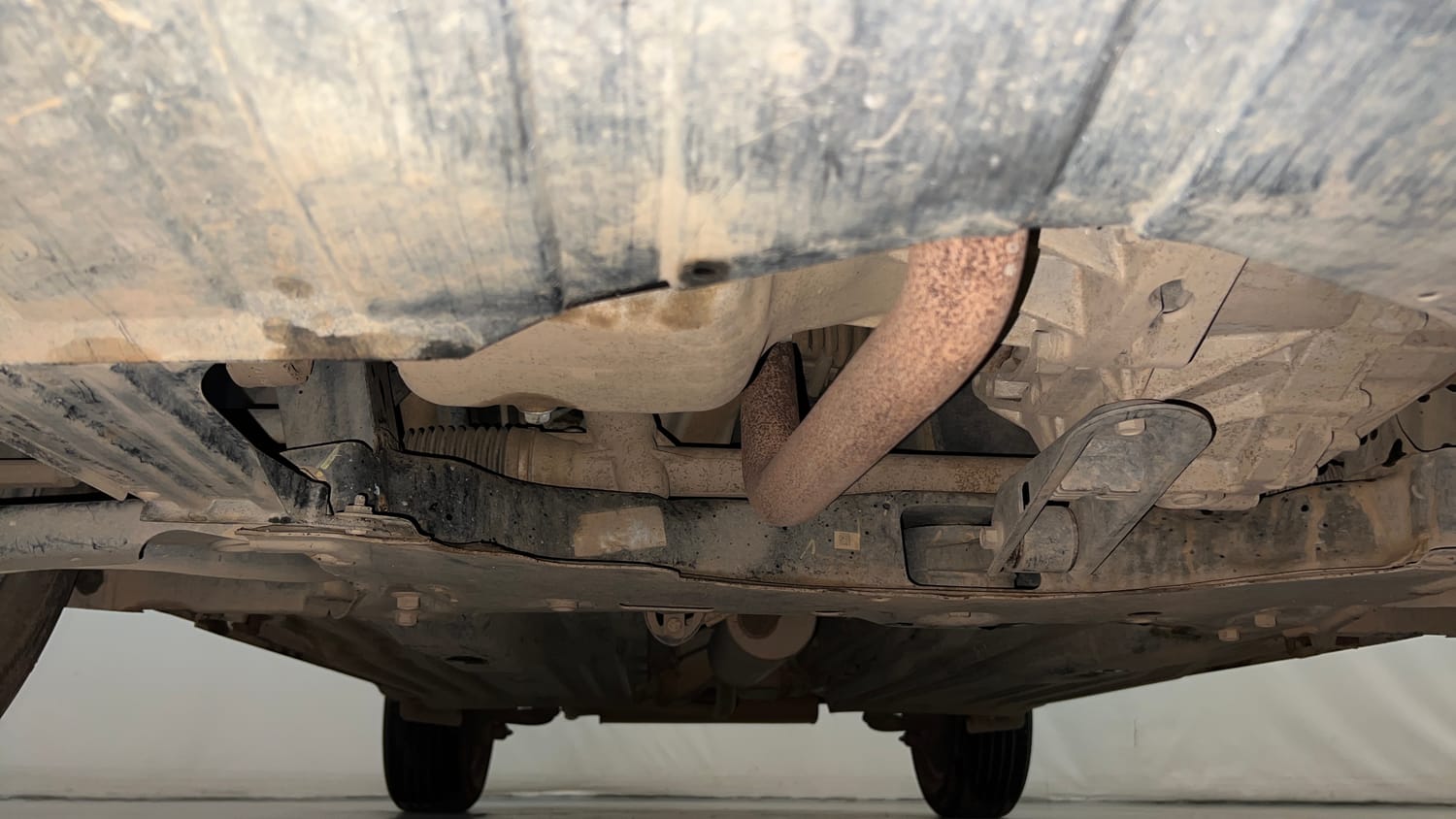 Used 2024 Maruti Suzuki Brezza VXi Petrol Manual extra FRONT LEFT UNDERBODY VIEW