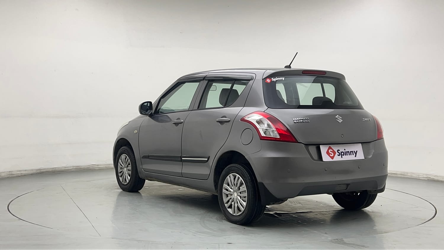 Used 2017 Maruti Suzuki Swift Lxi (O) Petrol Manual exterior LEFT REAR CORNER VIEW