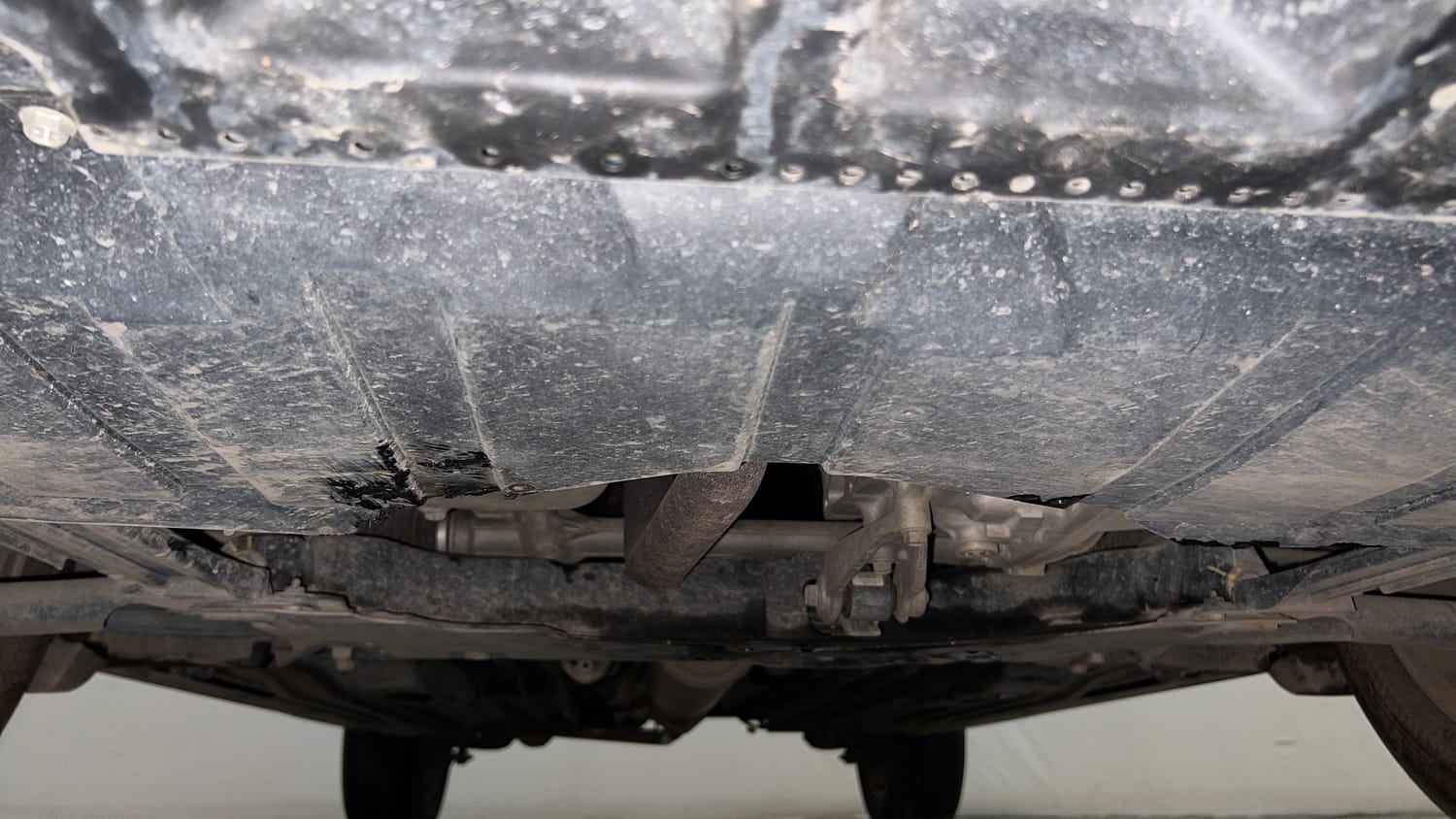 Used 2024 Maruti Suzuki Grand Vitara Zeta Smart Hybrid AT Petrol Automatic extra FRONT LEFT UNDERBODY VIEW