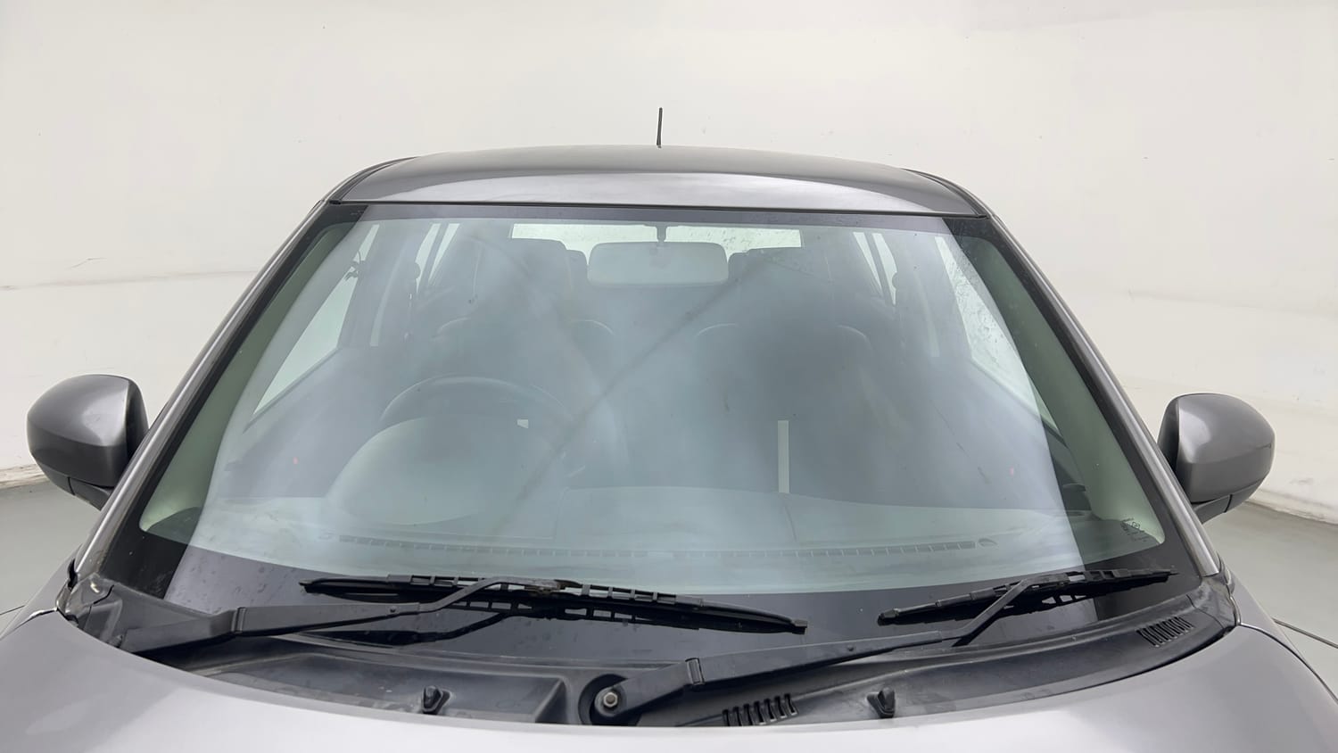 Used 2017 Maruti Suzuki Swift Lxi (O) Petrol Manual exterior FRONT WINDSHIELD VIEW