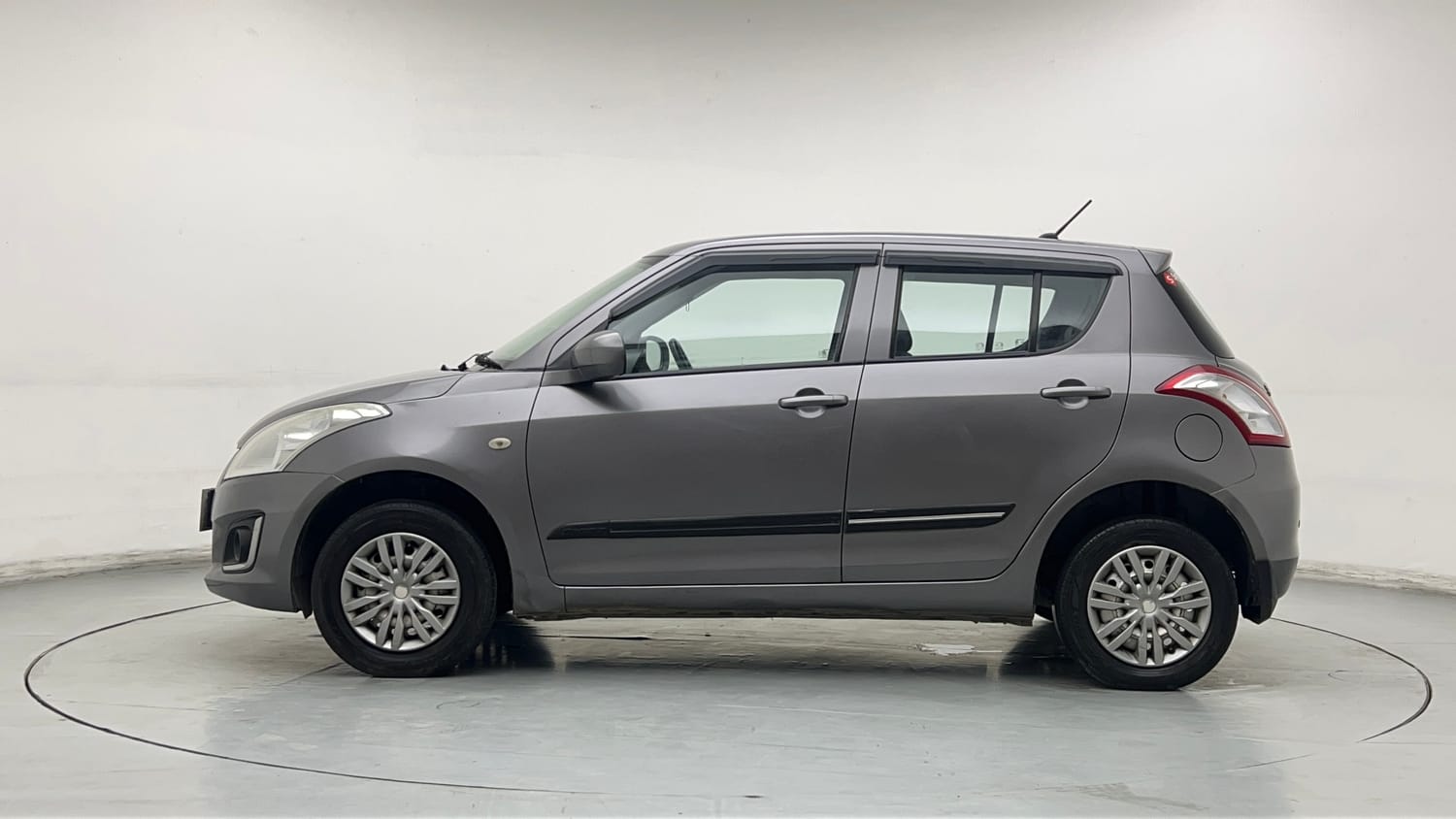 Used 2017 Maruti Suzuki Swift Lxi (O) Petrol Manual exterior LEFT SIDE VIEW