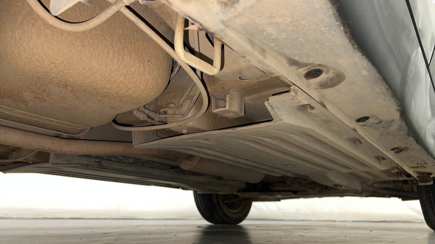 Used 2024 Maruti Suzuki Brezza VXi Petrol Manual extra REAR RIGHT UNDERBODY VIEW