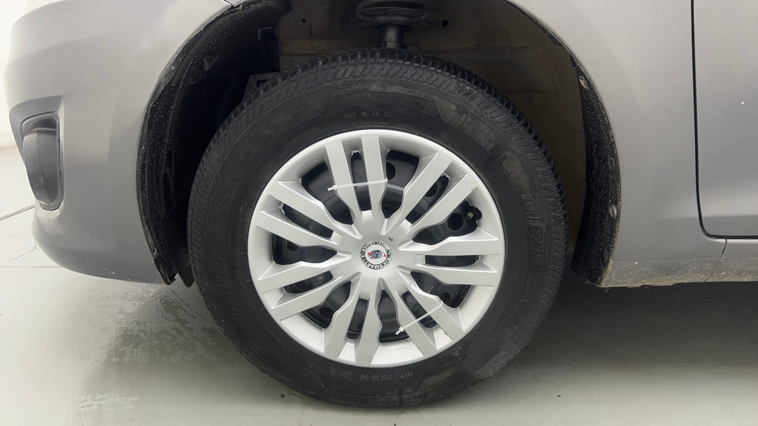 Used 2013 Maruti Suzuki Swift Dzire VXI Petrol Manual tyres LEFT FRONT TYRE RIM VIEW