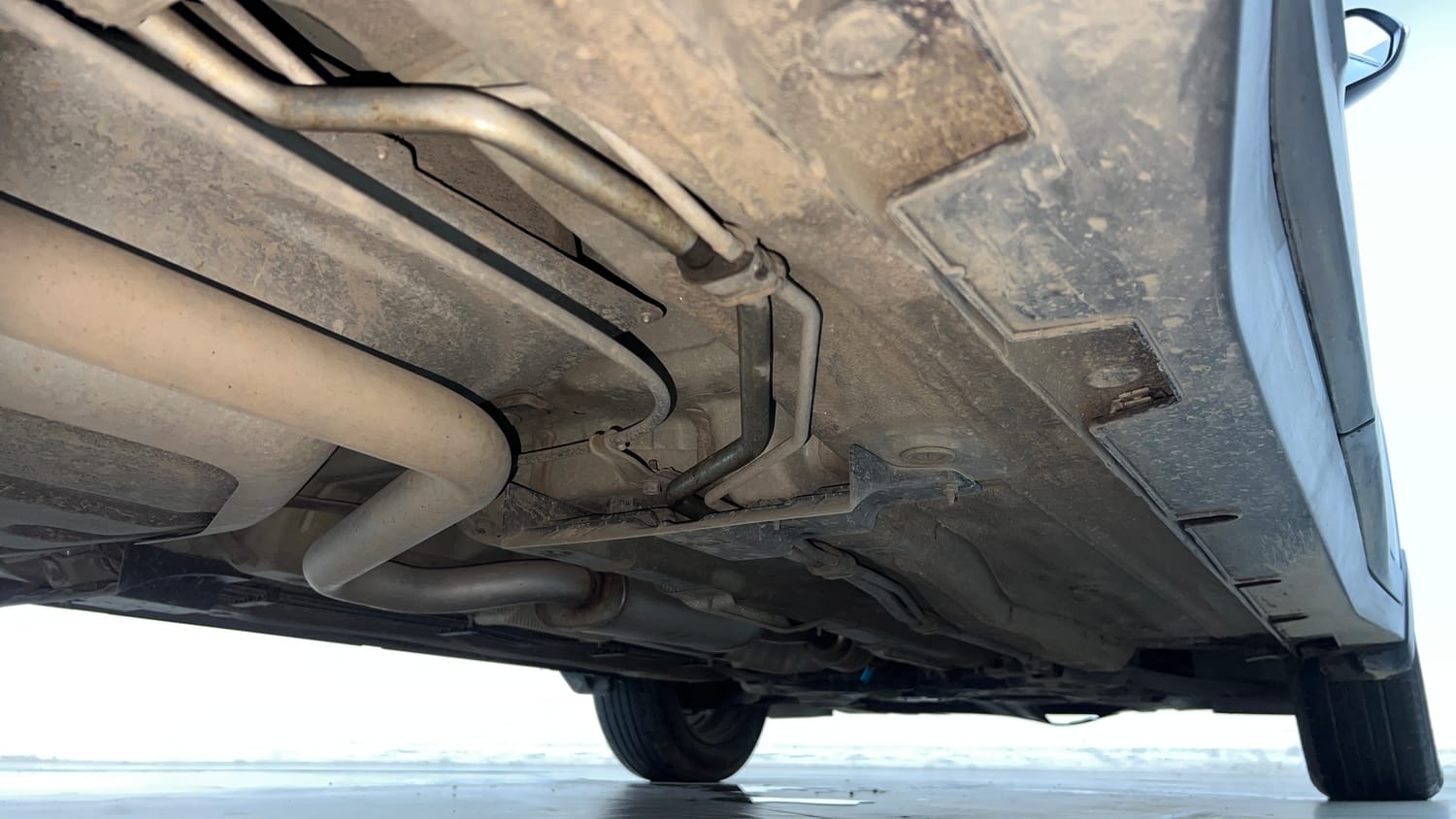Used 2022 Kia Carens Prestige Plus 1.4 Petrol DCT 7 STR Petrol Automatic extra REAR RIGHT UNDERBODY VIEW