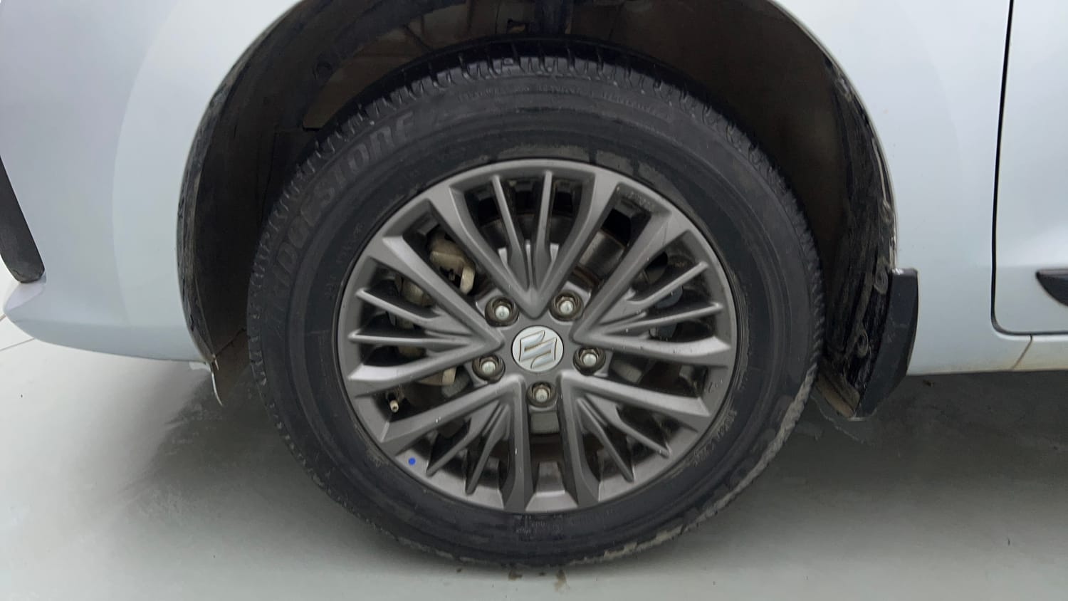 Used 2022 Maruti Suzuki New Ertiga VXi Petrol Manual tyres LEFT FRONT TYRE RIM VIEW