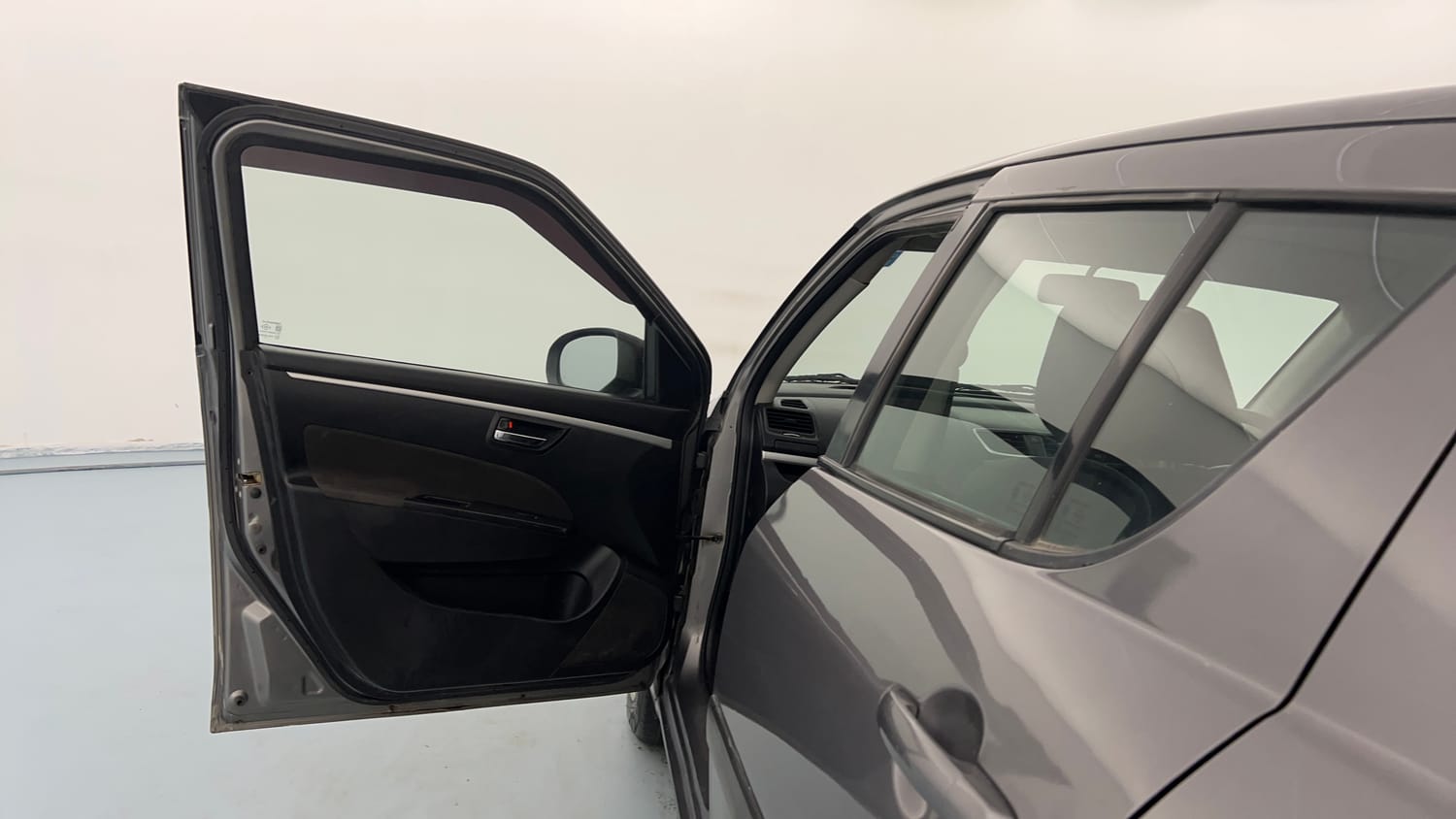 Used 2013 Maruti Suzuki Swift VXi Petrol Manual interior LEFT FRONT DOOR OPEN VIEW