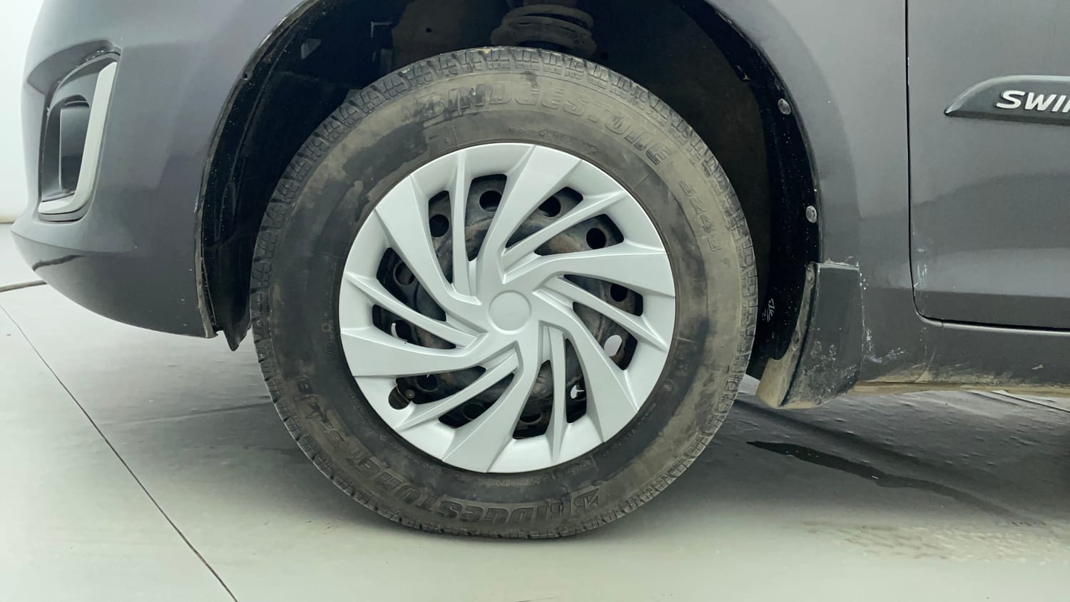 Used 2015 Maruti Suzuki Swift VXi Petrol Manual tyres LEFT FRONT TYRE RIM VIEW