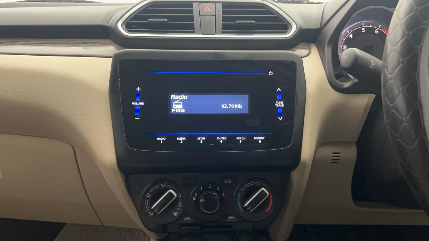 Used 2022 Maruti Suzuki Dzire VXi Petrol Manual top_features Integrated (in-dash) music system