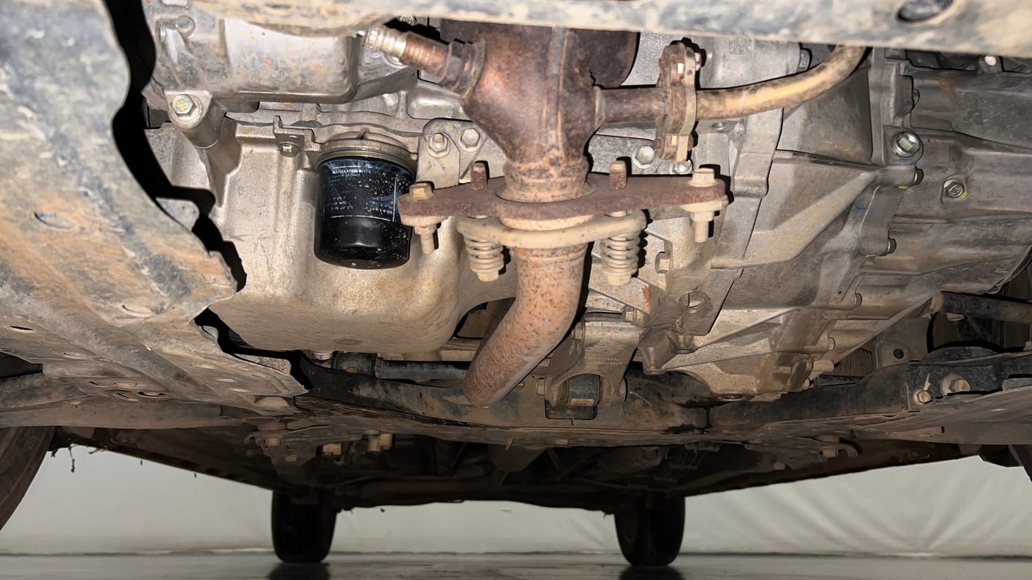 Used 2023 Maruti Suzuki XL6 Alpha Plus MT Petrol Petrol Manual extra FRONT LEFT UNDERBODY VIEW