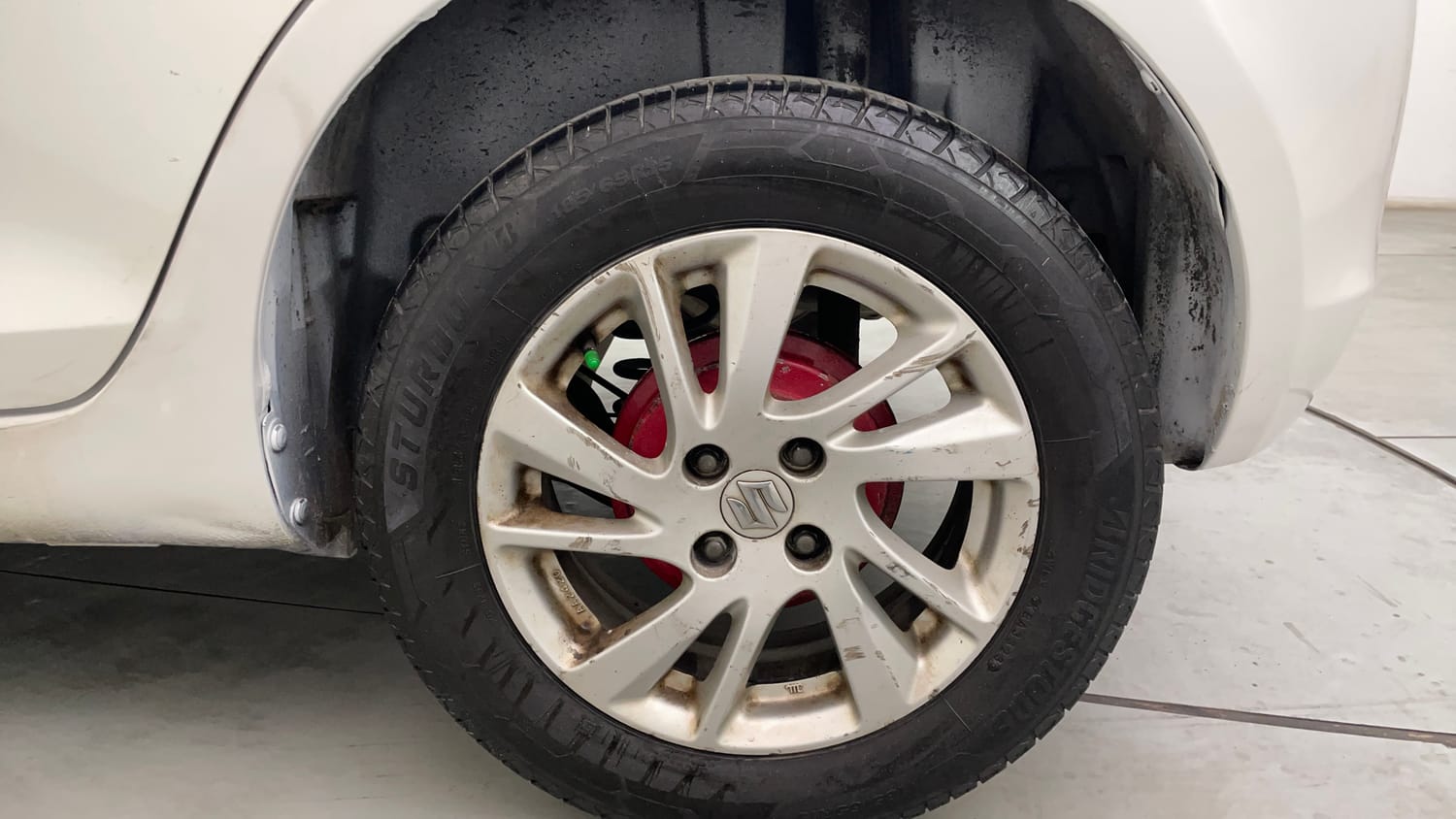 Used 2014 Maruti Suzuki Swift ZDi Diesel Manual tyres LEFT REAR TYRE RIM VIEW