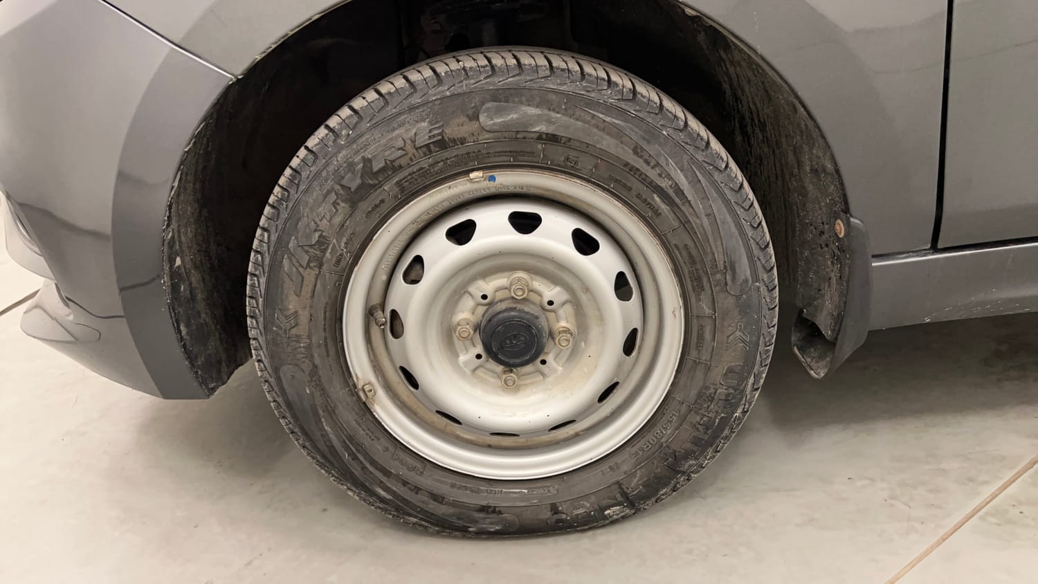 Used 2024 Tata Tiago XE Petrol Manual tyres LEFT FRONT TYRE RIM VIEW