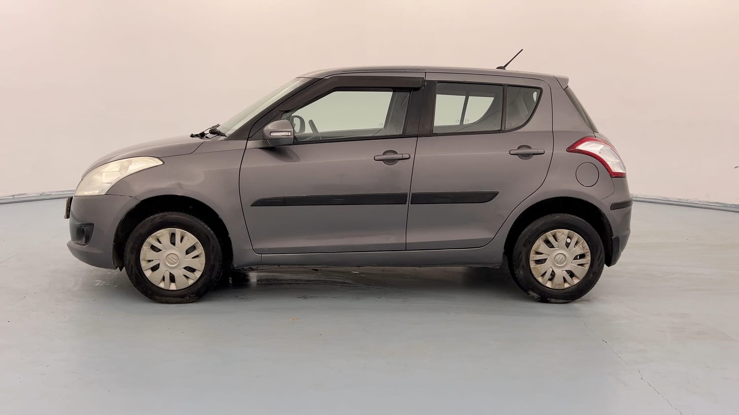 Used 2013 Maruti Suzuki Swift VXi Petrol Manual exterior LEFT SIDE VIEW