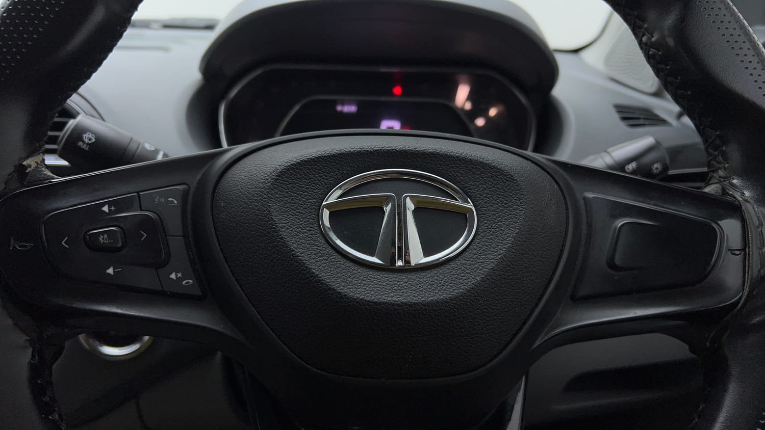 Used 2021 Tata Tigor XZ Petrol Manual top_features Steering mounted controls