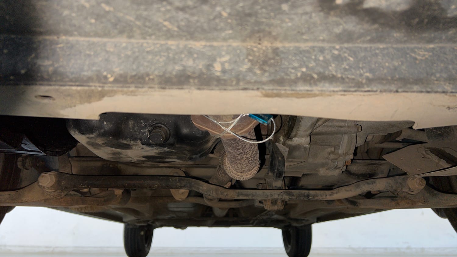 Used 2021 Tata Tigor XZ Petrol Manual extra FRONT LEFT UNDERBODY VIEW