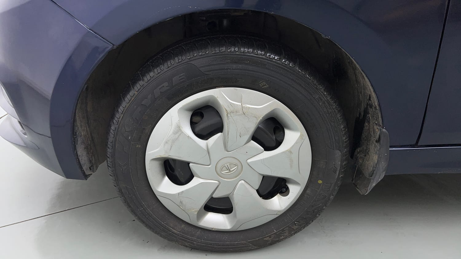 Used 2021 Tata Tigor XZ Petrol Manual tyres LEFT FRONT TYRE RIM VIEW