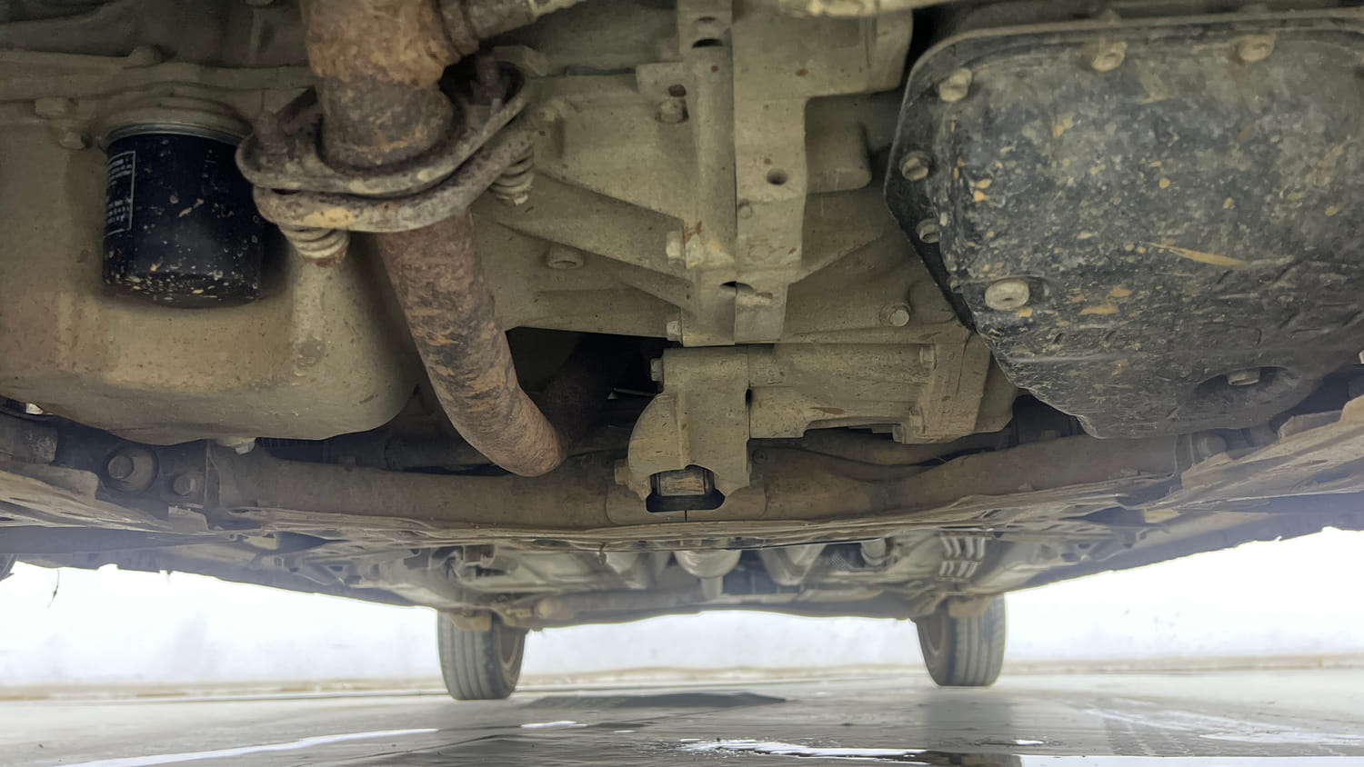 Used 2021 Maruti Suzuki New Ertiga VXi AT Petrol Automatic extra FRONT LEFT UNDERBODY VIEW