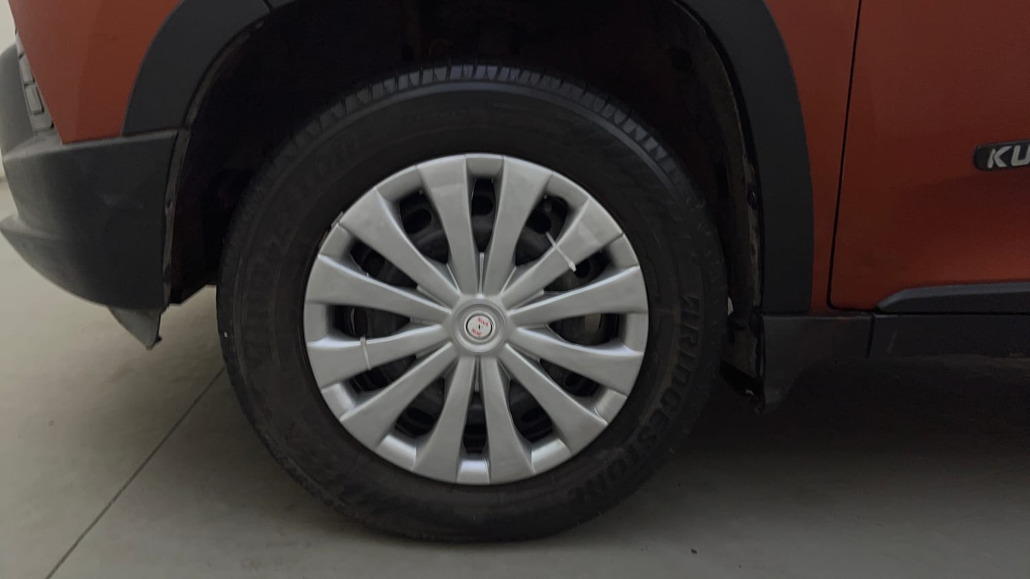 Used 2016 Mahindra KUV100 K6+ 6 STR Petrol Manual tyres LEFT FRONT TYRE RIM VIEW