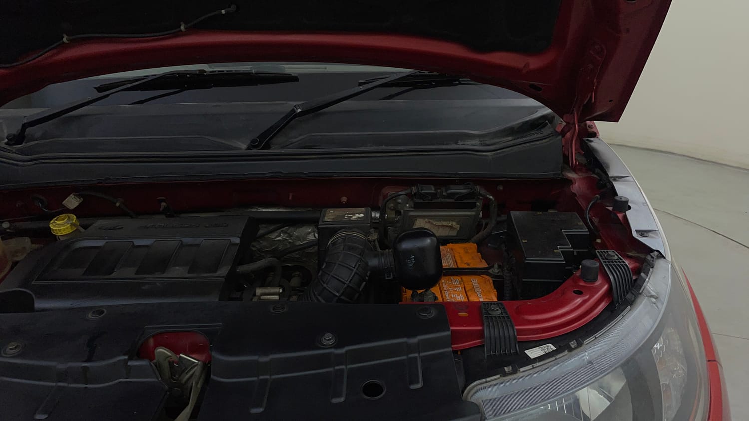 Used 2016 Mahindra KUV100 K4 6 STR Petrol Manual engine ENGINE LEFT SIDE HINGE & APRON VIEW