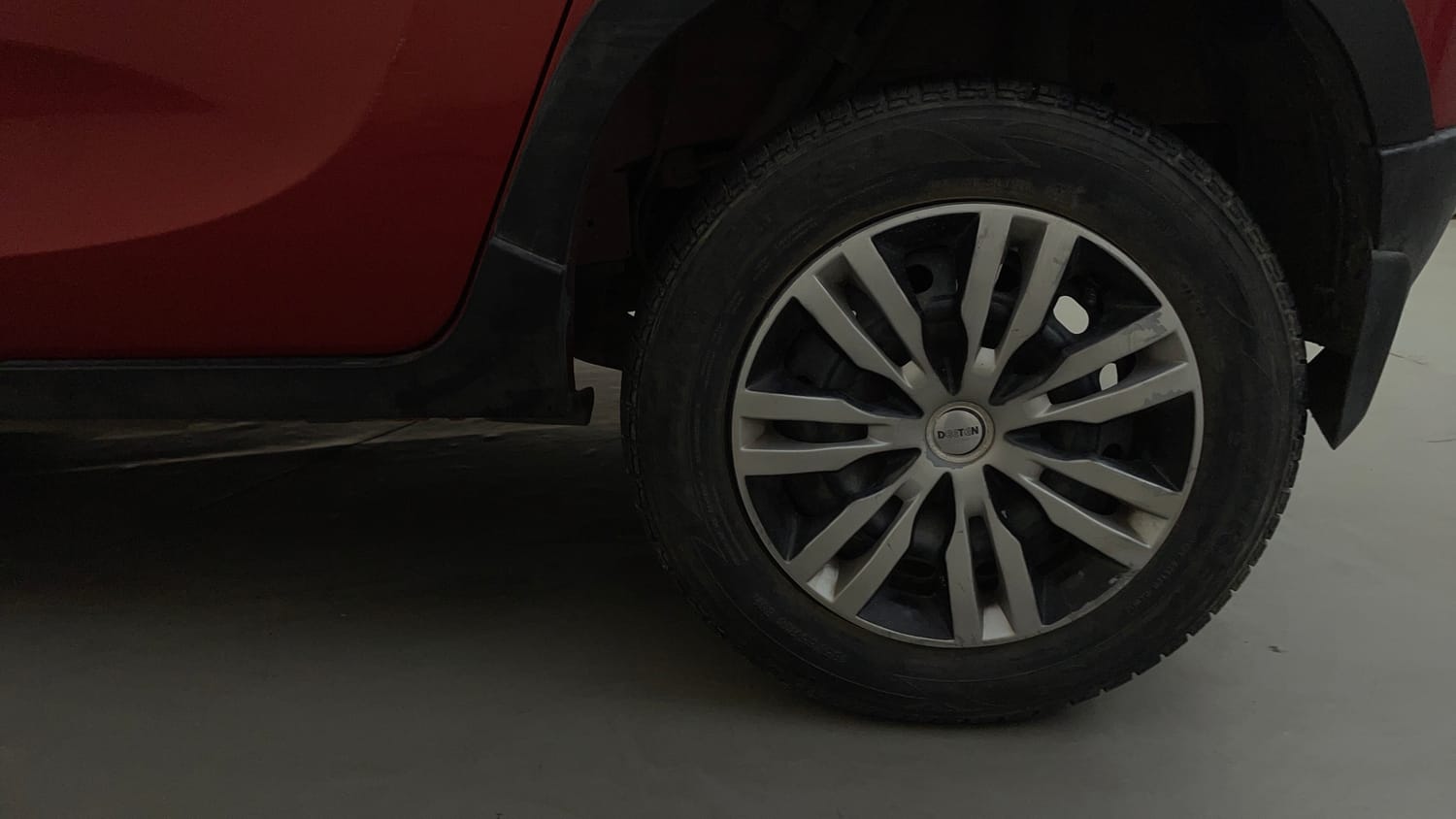 Used 2016 Mahindra KUV100 K4 6 STR Petrol Manual tyres LEFT REAR TYRE RIM VIEW
