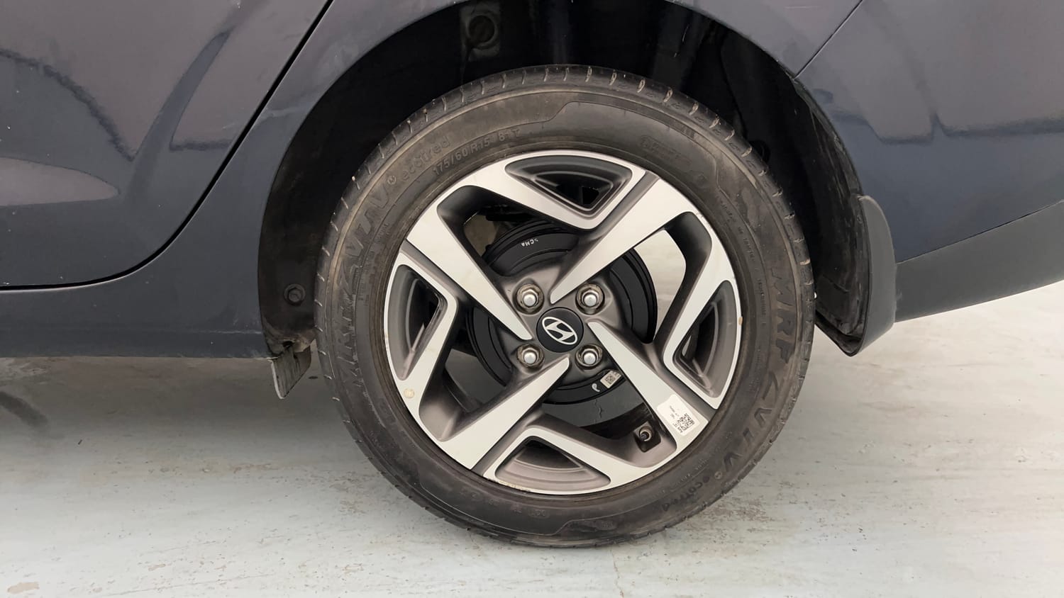Used 2023 Hyundai Aura SX 1.2 (O) Petrol Petrol Manual tyres LEFT REAR TYRE RIM VIEW