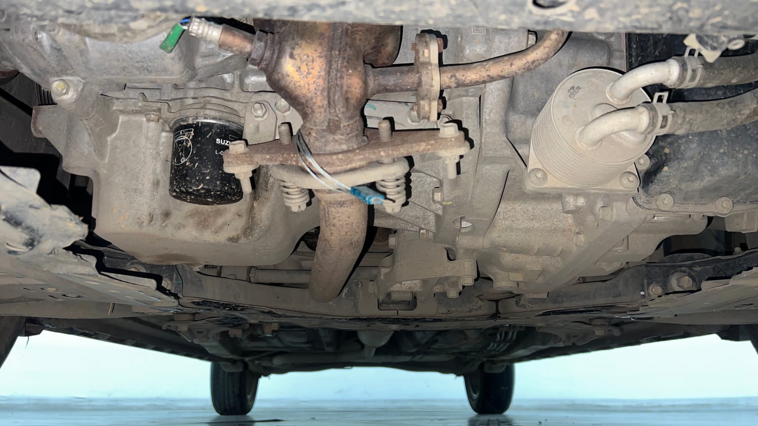Used 2024 Maruti Suzuki XL6 Alpha AT Petrol Petrol Automatic extra FRONT LEFT UNDERBODY VIEW