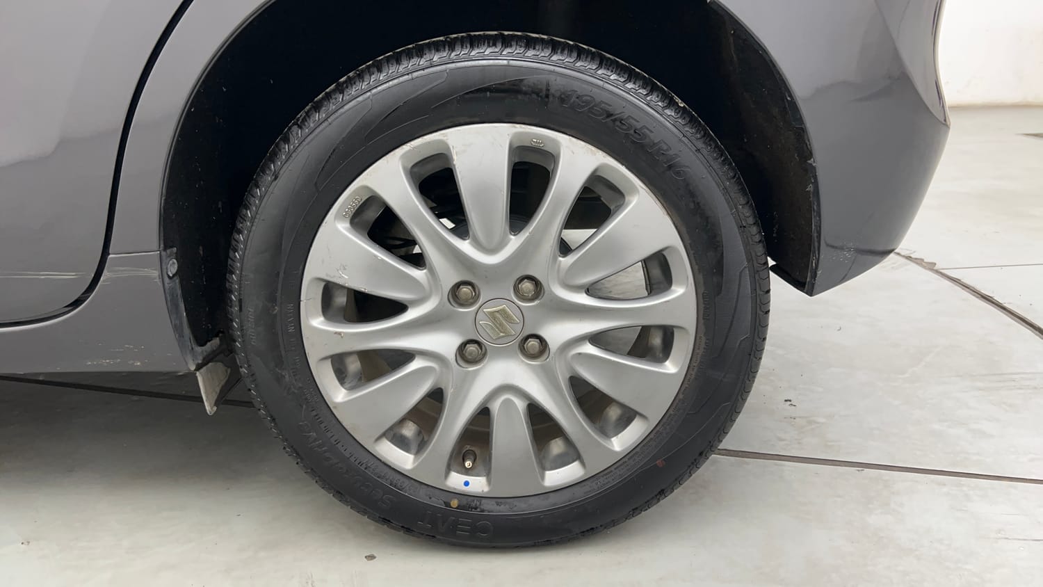 Used 2016 Maruti Suzuki Baleno Zeta 1.2 Petrol Manual tyres LEFT REAR TYRE RIM VIEW