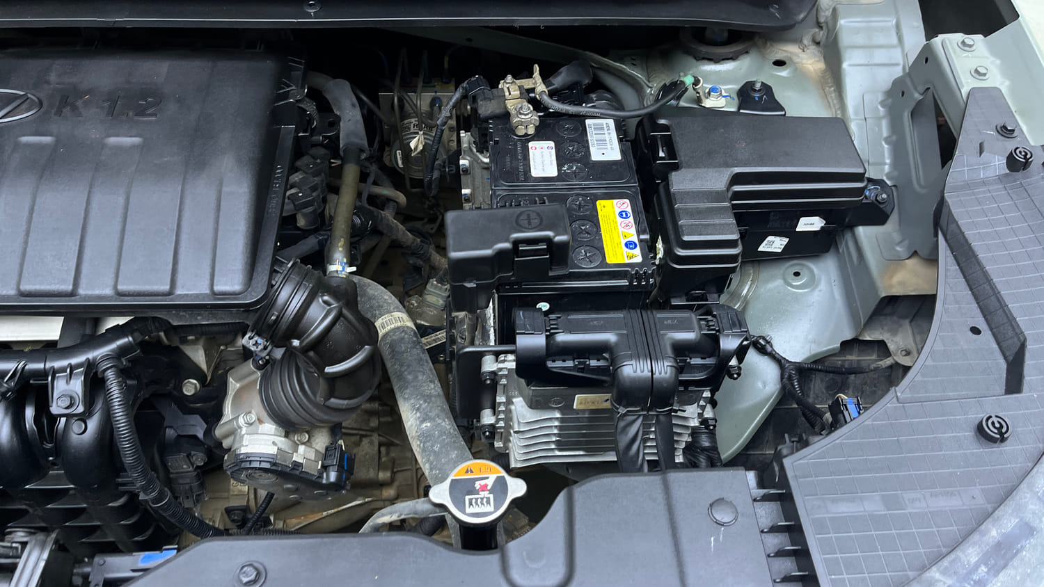 Used 2023 Hyundai Exter SX (O) Connect 1.2 AMT Dual Tone Petrol Automatic engine ENGINE LEFT SIDE VIEW