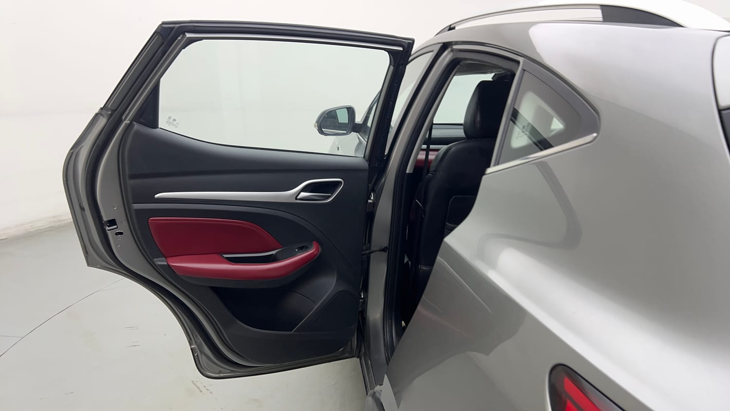 Used 2023 MG Motors Astor Savvy 1.3 Turbo AT S Red Petrol Automatic interior LEFT REAR DOOR OPEN VIEW