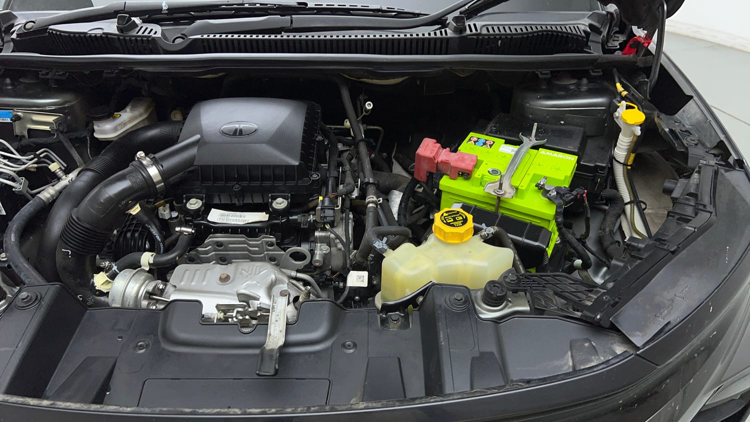 Used 2024 tata Nexon Fearless S 1.2 Revotron Petrol 7DCA Dual Tone Petrol Automatic engine ENGINE LEFT SIDE VIEW
