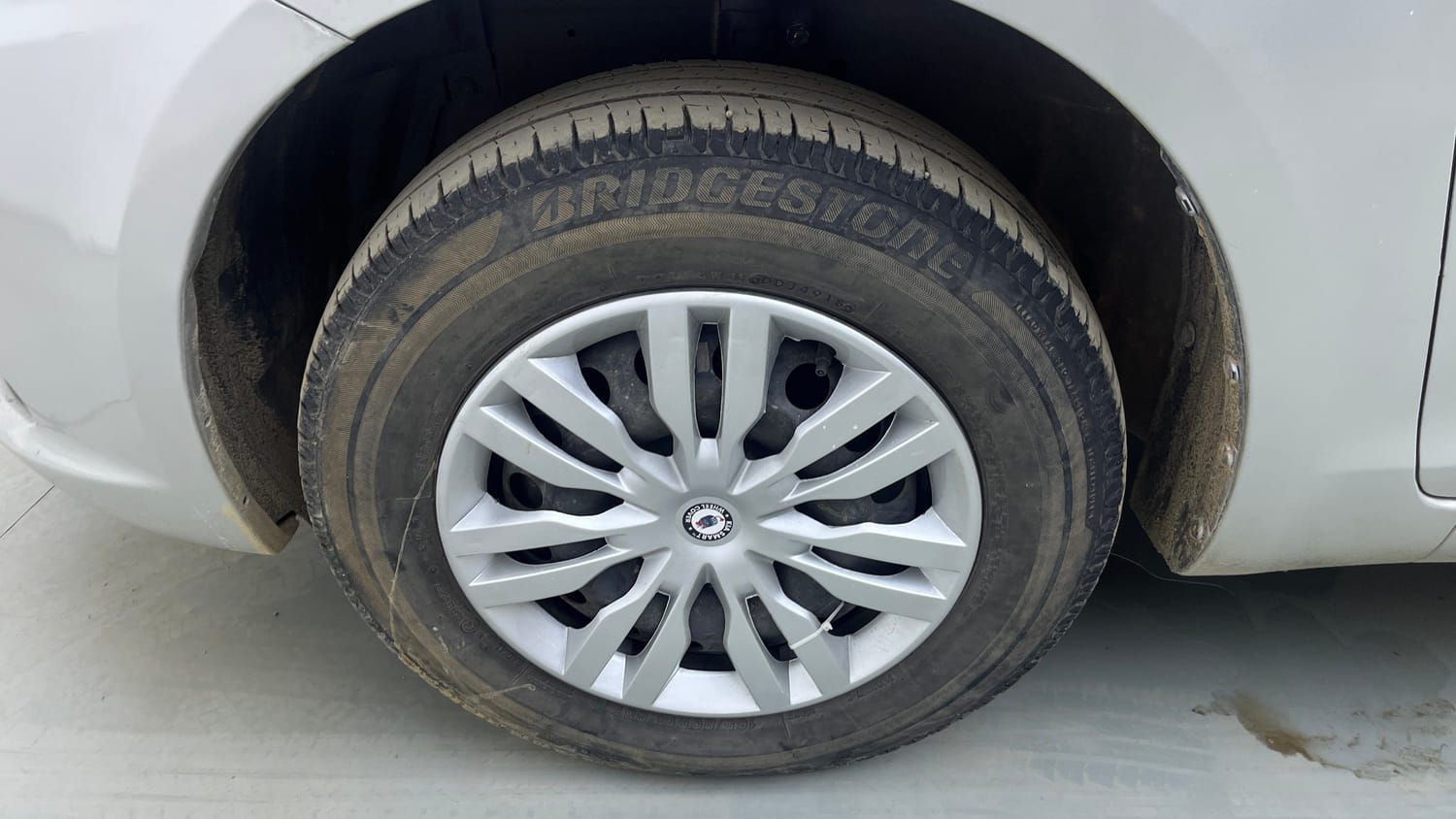 Used 2015 Maruti Suzuki Swift Dzire VXI Petrol Manual tyres LEFT FRONT TYRE RIM VIEW
